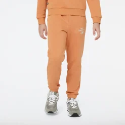 New Balance Spodnie dziecięce YP31508SEI – pomarańczowe