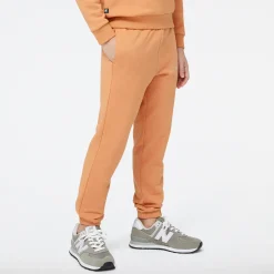 New Balance Spodnie dziecięce YP31508SEI – pomarańczowe